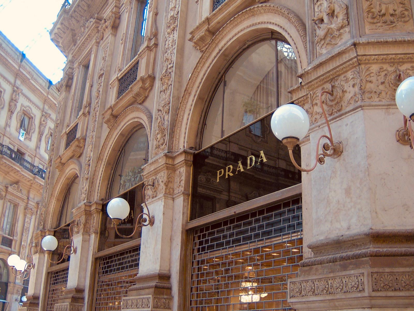 Prada boutique beneath ornate stone arches in Milan's Galleria Vittorio Emanuele II